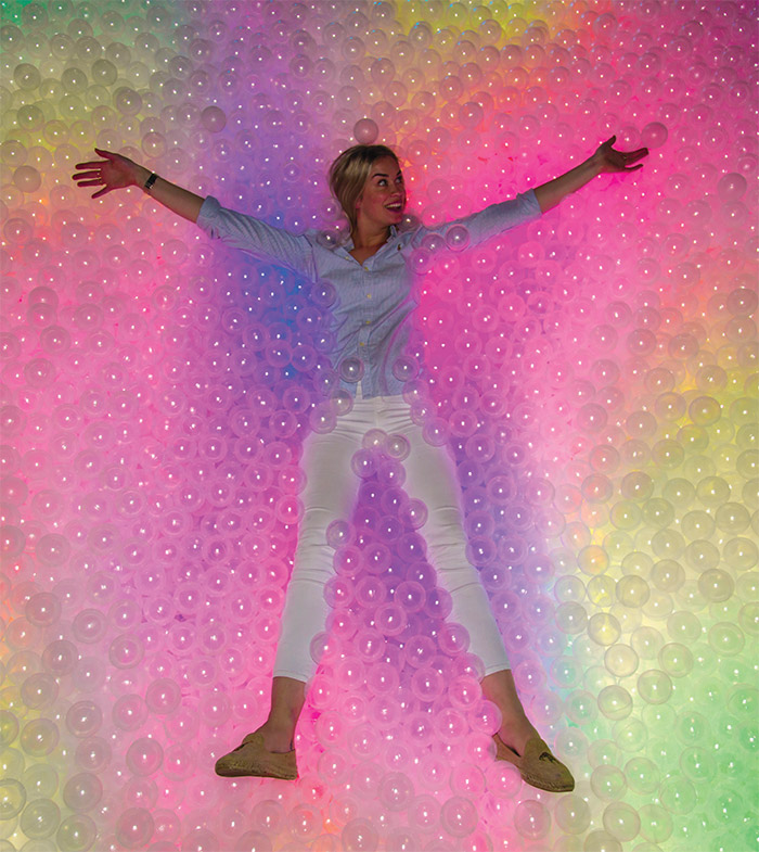 Woman lying in a ballpit